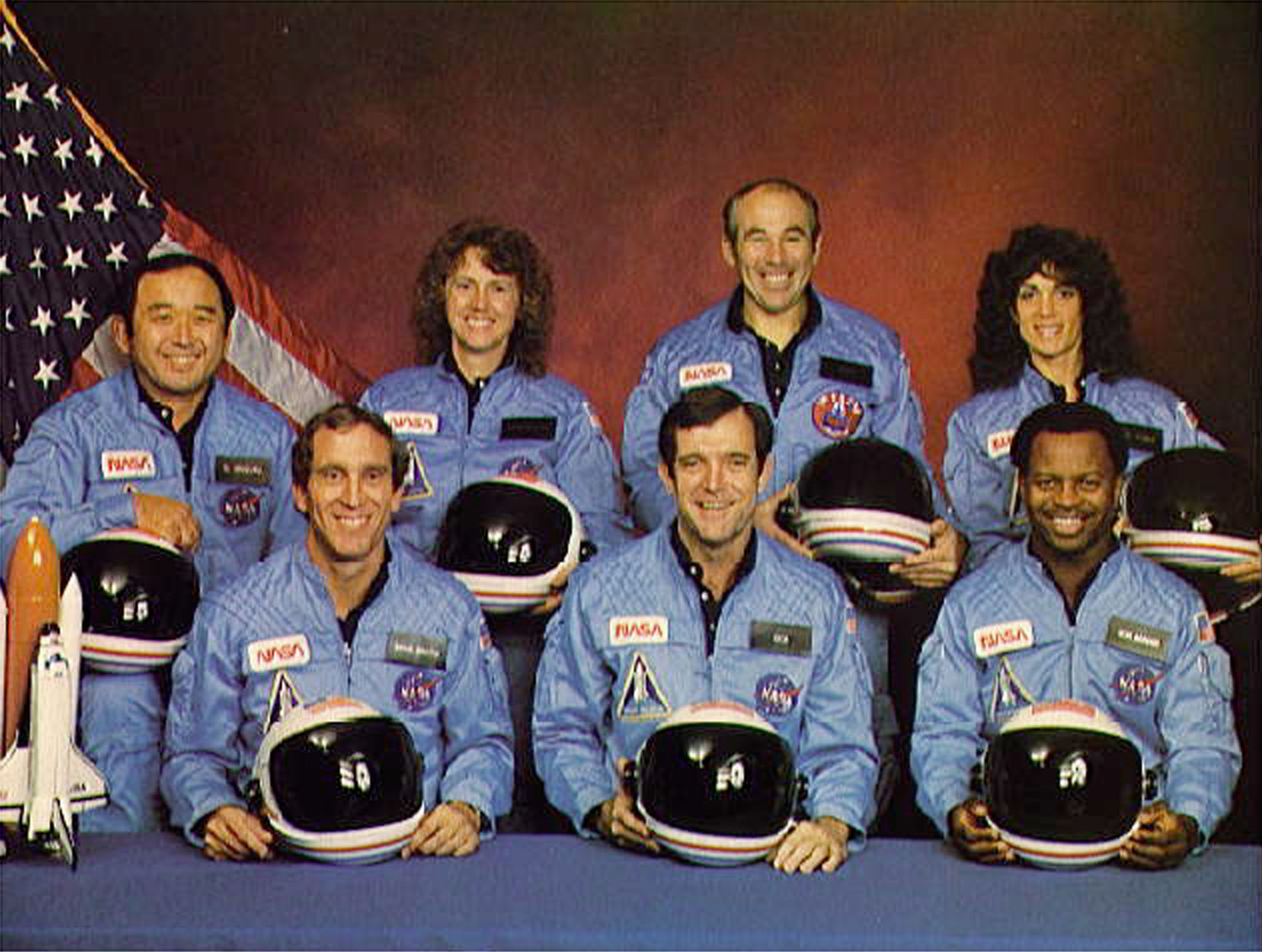 (FILE PHOTO)  Space Shuttle Challenger crew members gather for an official portrait November 11, 1985 in an unspecified location. (Back, L-R) Mission Specialist Ellison S. Onizuka, Teacher-in-Space participant Sharon Christa McAuliffe, Payload Specialist Greg Jarvis and mission specialist Judy Resnick. (Front, L-R) Pilot Mike Smith, commander Dick Scobee and mission specialist Ron McNair. The Challenger and its seven member crew were lost seventy three seconds after launch when a booster rocket failed.  (Photo by NASA/Getty Images)