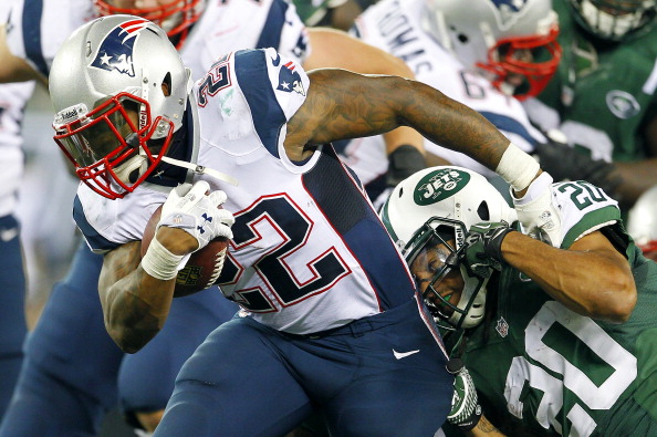 EAST RUTHERFORD, NJ - NOVEMBER 22: Running back Stevan Ridley #22 of the New England Patriots fights off Kyle Wilson #20 of the New York Jets during the second half of a game at MetLife Stadium on November 22, 2012 in East Rutherford, New Jersey. The Patriots defeated the Jets 49-19. (Photo by Rich Schultz /Getty Images)