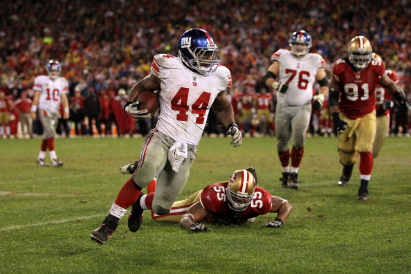 SAN FRANCISCO, CA - JANUARY 22:  Ahmad Bradshaw #44 of the New York Giants runs the bal lagainst Ahmad Brooks #55 of the San Francisco 49ers during the NFC Championship Game at Candlestick Park on January 22, 2012 in San Francisco, California.  (Photo by Jamie Squire/Getty Images)