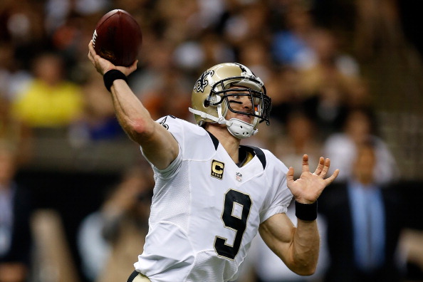 NEW ORLEANS, LA - SEPTEMBER 22:  Drew Brees #9 of the New Orleans Saints throws a pass against the Arizona Cardinals at the Mercedes-Benz Superdome on September 22, 2013 in New Orleans, Louisiana.  (Photo by Chris Graythen/Getty Images)