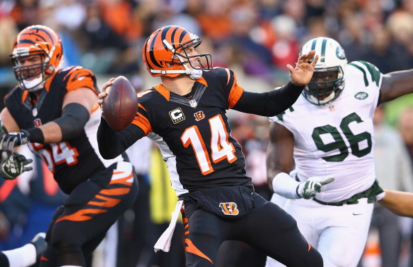 CINCINNATI, OH - OCTOBER 27:  Andy Dalton #14 of the Cincinnati Bengals throws a pass during the NFL game against the New York Jets at Paul Brown Stadium on October 27, 2013 in Cincinnati, Ohio.  (Photo by Andy Lyons/Getty Images)