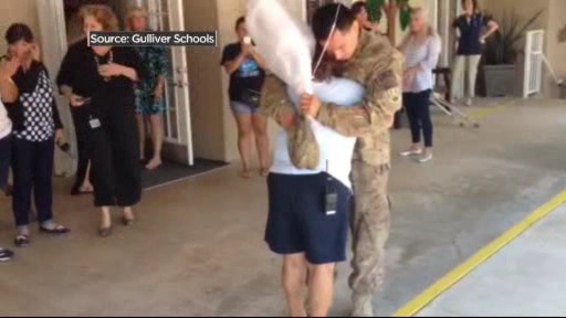 Soldier surprises mom at work. (Source: Gulliver Schools) 