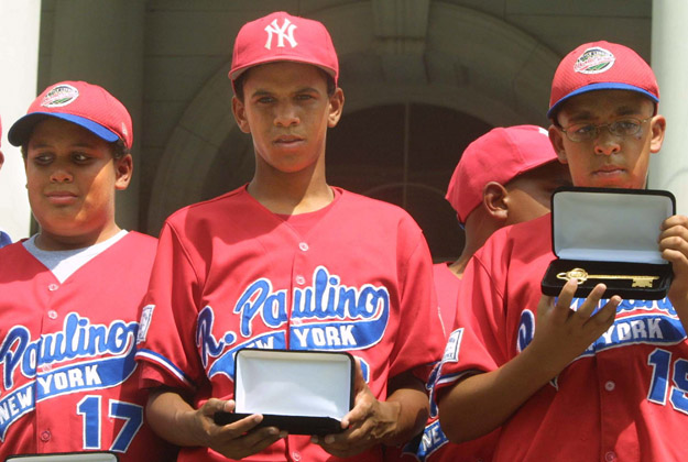 393788 05: (FILE PHOTO) Danny Almonte (C) and other members of the Rolando Paulino All-Stars Bronx Little League baseball team hold their keys to the city during a ceremony honoring the team August 28, 2001 in New York City. Dominican Republic officials said August 31, 2001 that Little League pitcher Danny Almonte is 14 years old, not 12 years old. The finding could strip his team of its third-place finish in the World Series. 