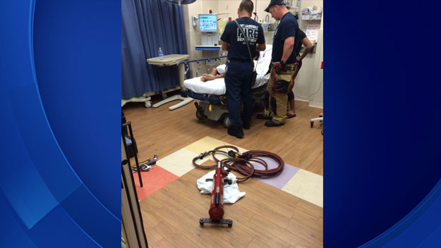 Firefighters help a boy who got his finger stuck in a metal pipe.  (Photo source: FLFD)
