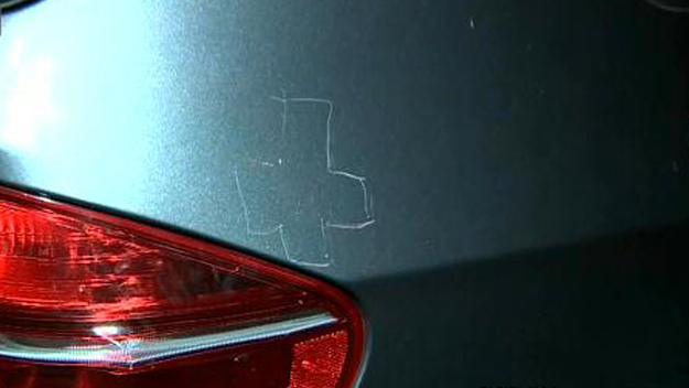 Symbols of hate were found scrawled on an SUV owned by the wife of a South Florida rabbi. (Source: CBS4) 