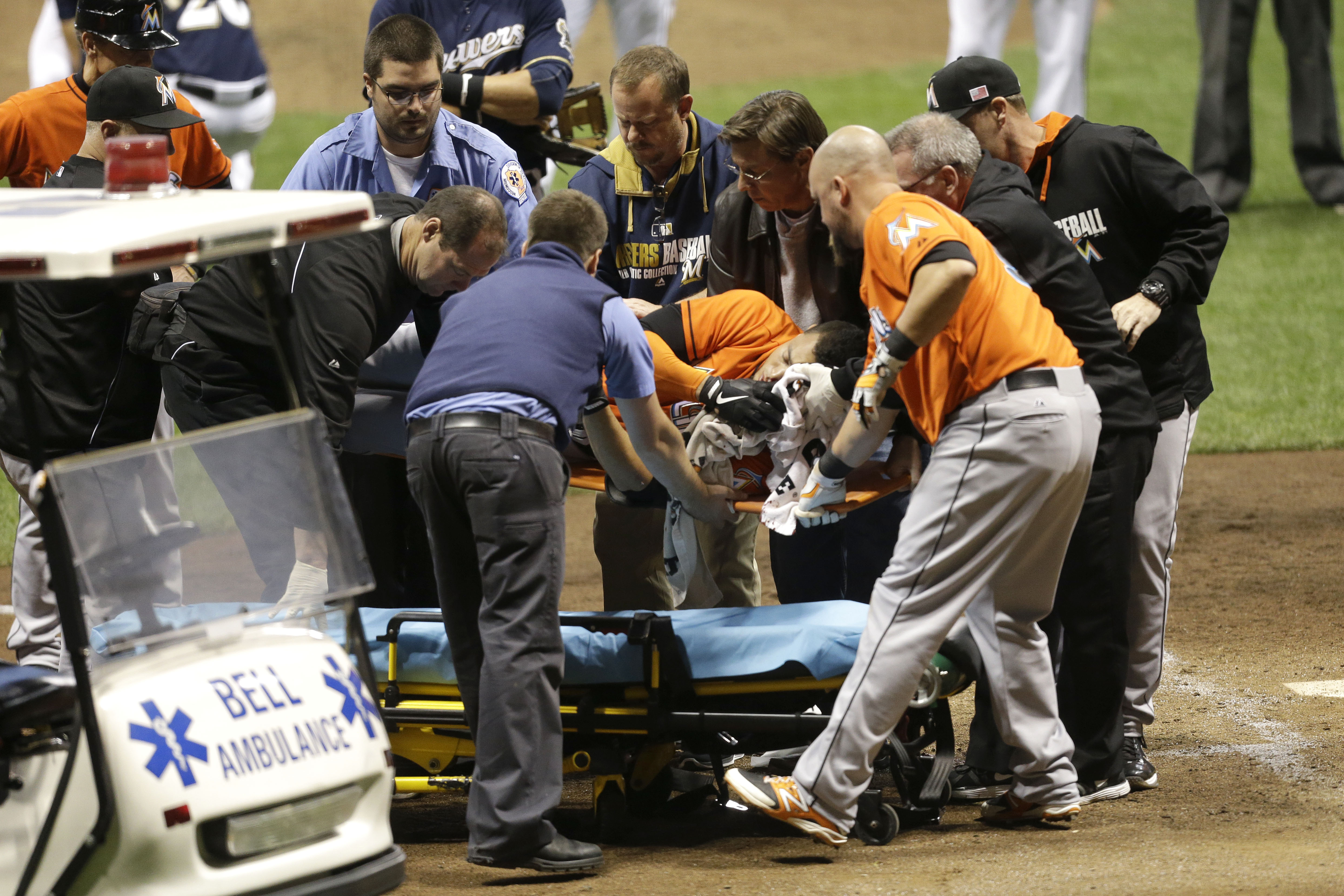 Giancarlo Stanton #27 of the Miami Marlins is lifted onto a stretcher after getting hit by a pitch from Mike Fiers of the Milwaukee Brewers during the top of the fifth inning at Miller Park on September 11, 2014 in Milwaukee, Wisconsin. (Photo by Mike McGinnis/Getty Images)