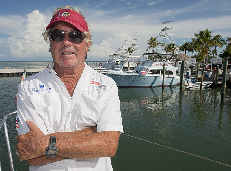Skip Bradeen, poses on the deck of his new Blue Chip Too, with his original Blue Chip Too in the background. In September 2014, Bradee began his 50th year in the Florida Keys charterboat business. Photo by Andy Newman/Florida Keys News Bureau