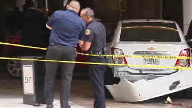 Several employees of a downtown Miami hotel were injured after a man stole a high priced car from in front of it.  (Source: CBS4) 