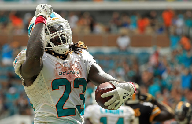 Jay Ajayi #23 of the Miami Dolphins celebrates a touchdown during a game against the Pittsburgh Steelers on October 16, 2016 in Miami Gardens, Florida.