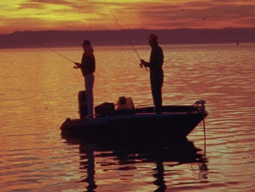 two men fishing from a boat thebookongonefishing