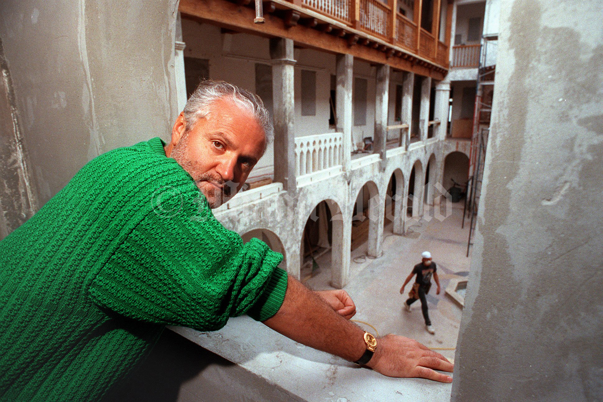 3/16/93,  Gianni Versace looking out from a second story window overlooking his patio. during the renovation works of his mansion.  Marice Cohn Band/Miami Herald Staff-- (Permission to republish provided by the Miami Herald Media Co.)