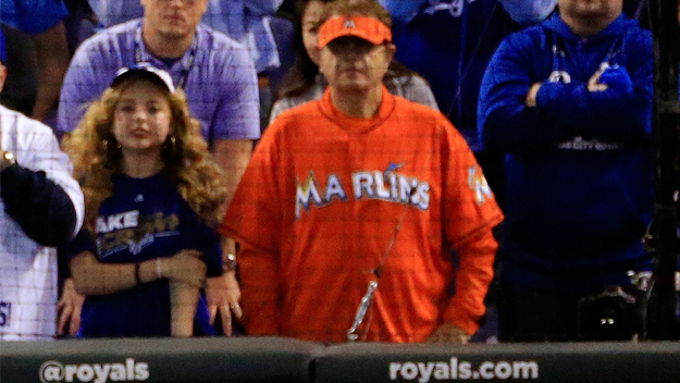 man in marlins jersey at baseball games