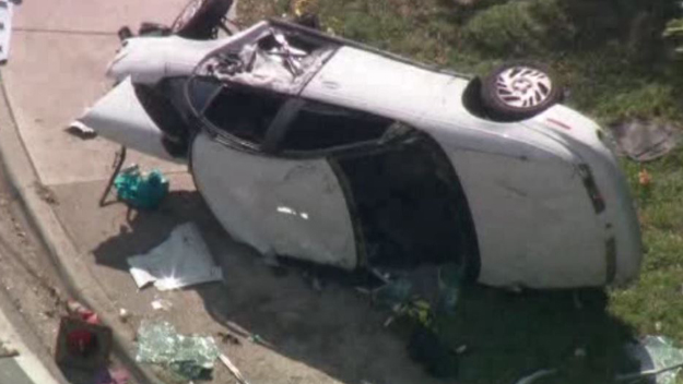 Car flipped on its side after crashing with an SUV in North Miami.(Source: CBS4)