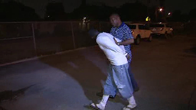 Bernard Aaron being escorted from a police station bound for the county jail on November 5, 2014 (Source: CBS4)