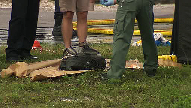 Authorities are investigating what happened to a man found dead, floating in a Miramar canal along with a bag on January 3, 2015. (Source: CBS4) 