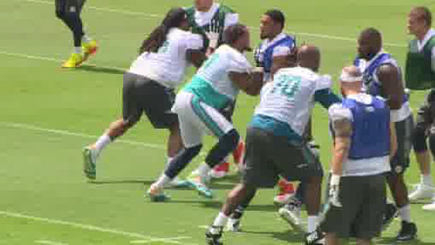 Members of the Miami Dolphins offensive line practicing during the team's first OTA workout of 2015 (Source: CBS4)