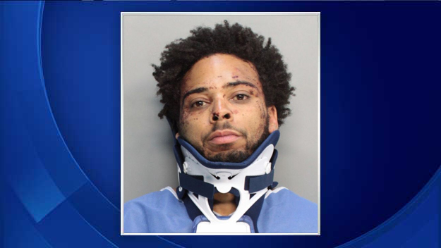 Officers say Russell McGruder, 34, jumped behind the wheel of a patrol car and took off. (Source: MDPD) 