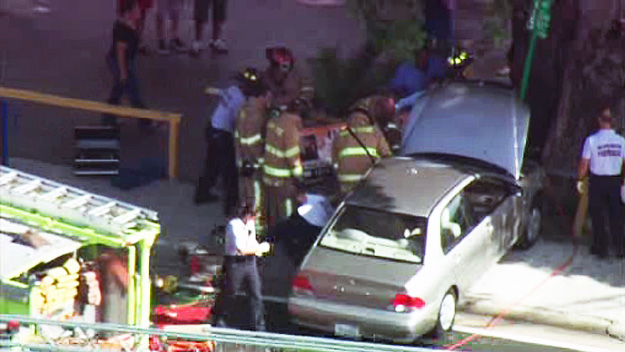 Crews rushed two people to the hospital after they were hit by a car near a bus stop in North Miami on July 24. 2015. (Source: CBS4) 