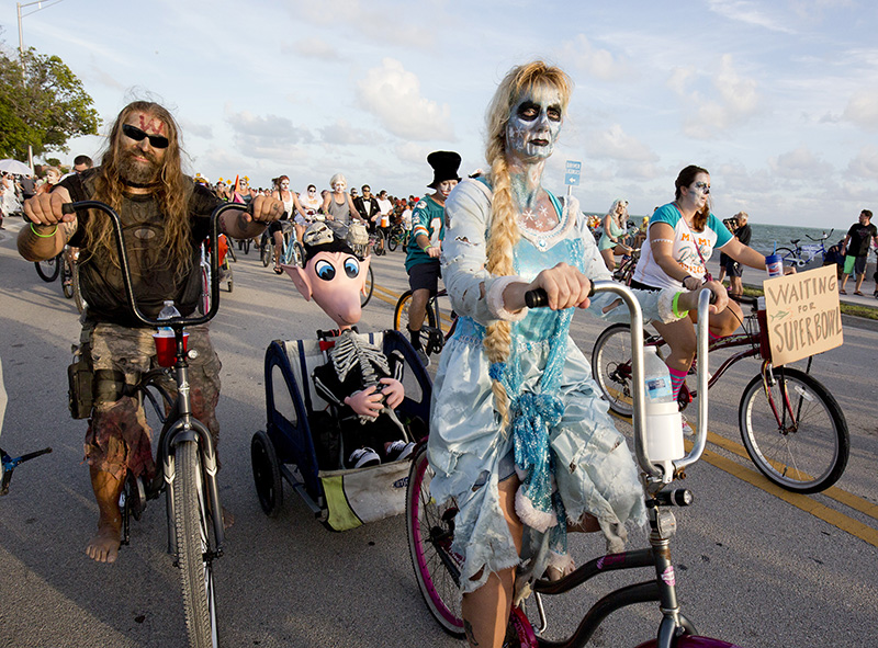 Costumed participants in the Zombie Bike Ride pedal down South Roosevelt Boulevard in Key West, Fla. More than 8,500 