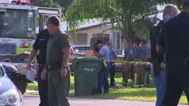 Miami-Dade Fire Rescue check out the scene after a man allegedly set his own father on fire. (Source: CBS4)