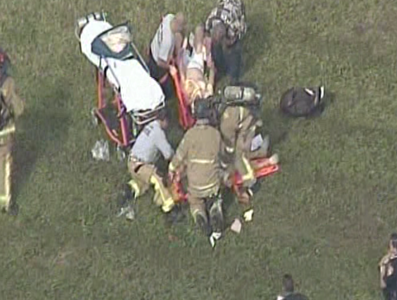 A plane went down in Opa Locka, injuring a number of people on Dec. 1, 2015. Miami-Dade Fire Rescue crews could be seen treating two patients. (Source: CBS4) 