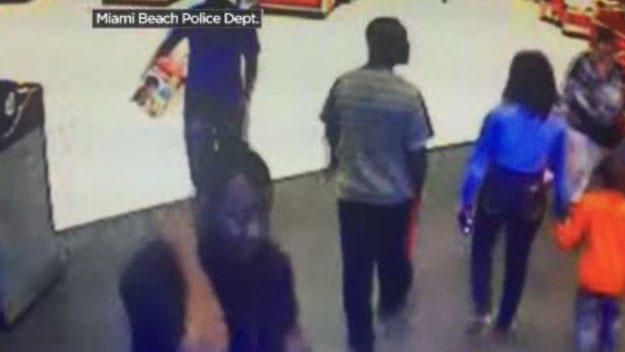Police want to identify the man in the lower-left, showing his face. He's wanted in connection to a stolen car in Miami Beach. (Source: Miami Beach Police Dept.)