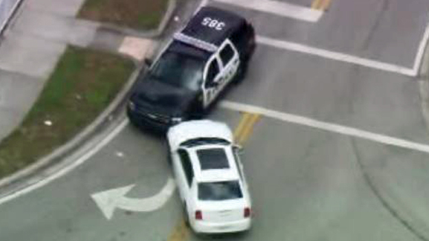 The white mark on the windshield of this Miami Gardens police SUV appears to be from a shot fired by an officer. (Source: Chopper4)