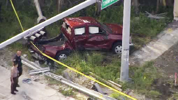 A red truckhad major damage to the bed of it near SW 152nd Street and Florida's Turnpike following an accident involving a school bus with children. (Source: CBS4) 