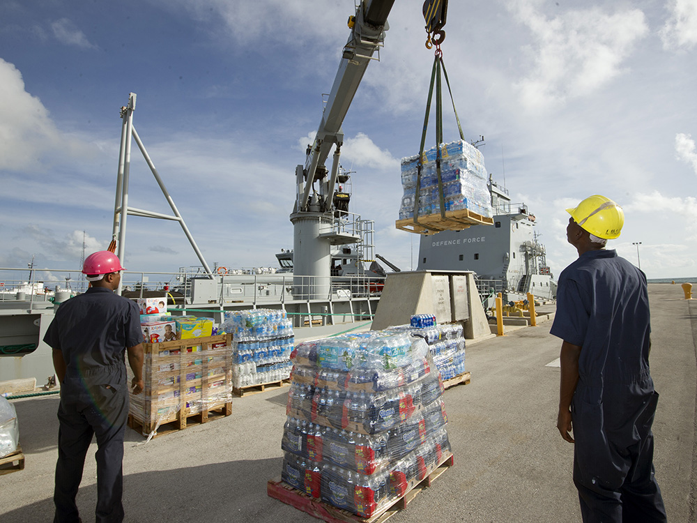 Bottled water is loaded on a Royal Bahamas Defence Force ship Friday, Oct. 7, 2016, in Key West, Fla. In less than 24 hours, Florida Keys residents donated some 25,000 bottles of water as well as diapers and other relief supplies which are to be transported to needy Bahamians. Nine Defence Force vessels took refuge at the U.S. Navy's Truman Pier in Key West to escape the wrath of Hurricane Matthew. Key West was the only city in Florida, that fronts on the Atlantic Ocean, that was not under a tropical cyclone watch or warning due to Matthew. (Rob O'Neal/Florida Keys News Bureau)