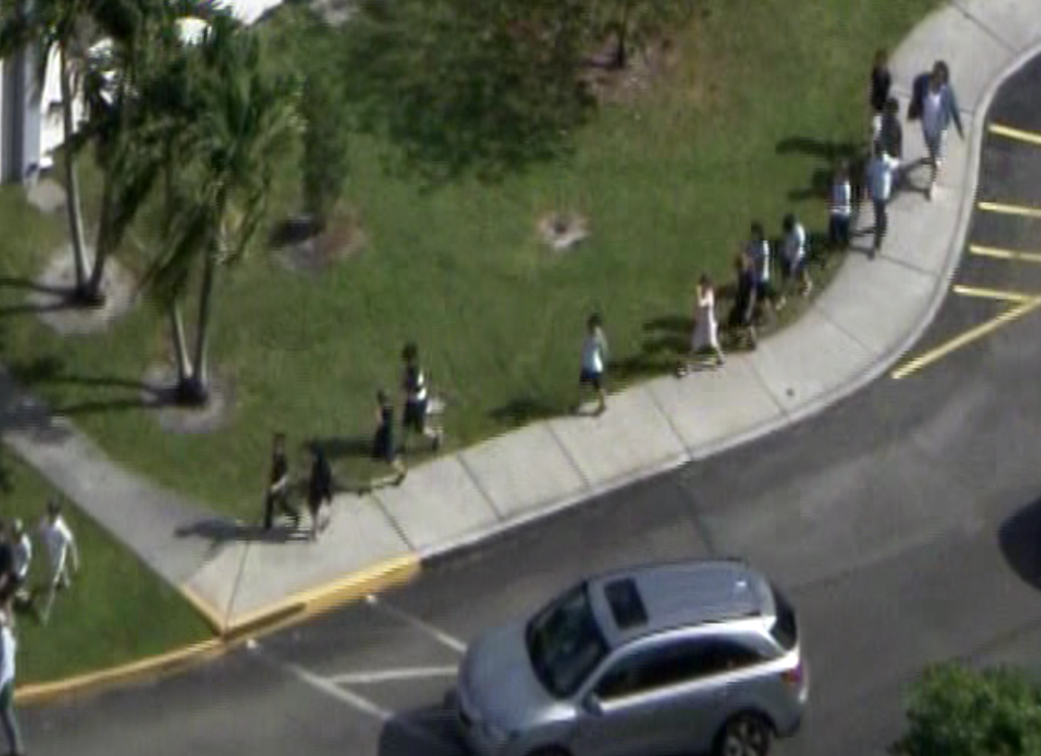 Students led out of the Posnack School and Jewish Community center in Davie on Monday, after a bomb threat was called in. (Source: CBS4)