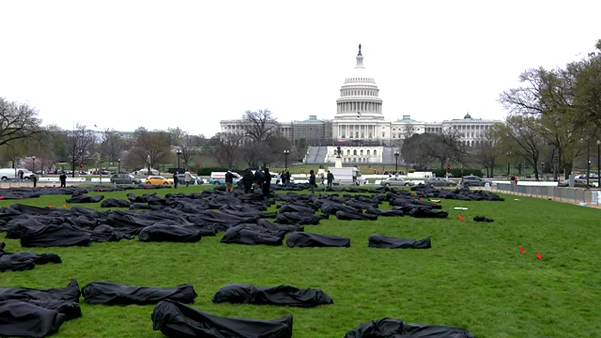 Activists Use Body Bags To Demand Change On 4 Year Annivesary Of ‘March For Our Lives’ Rally